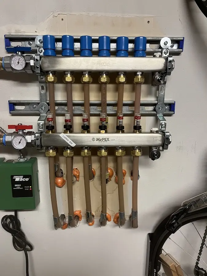 Plumber performing Water Heater Repair at a residential property in Kittery